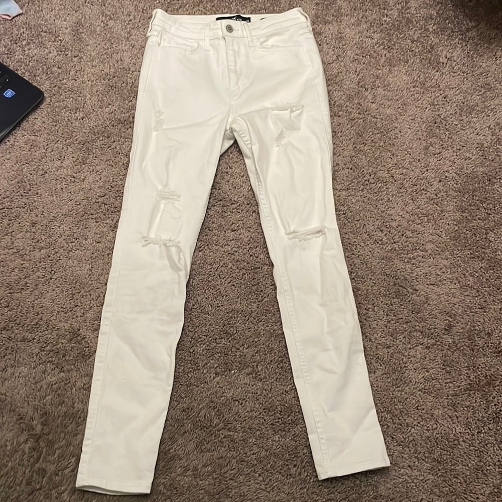 Skinny white jeans with rips